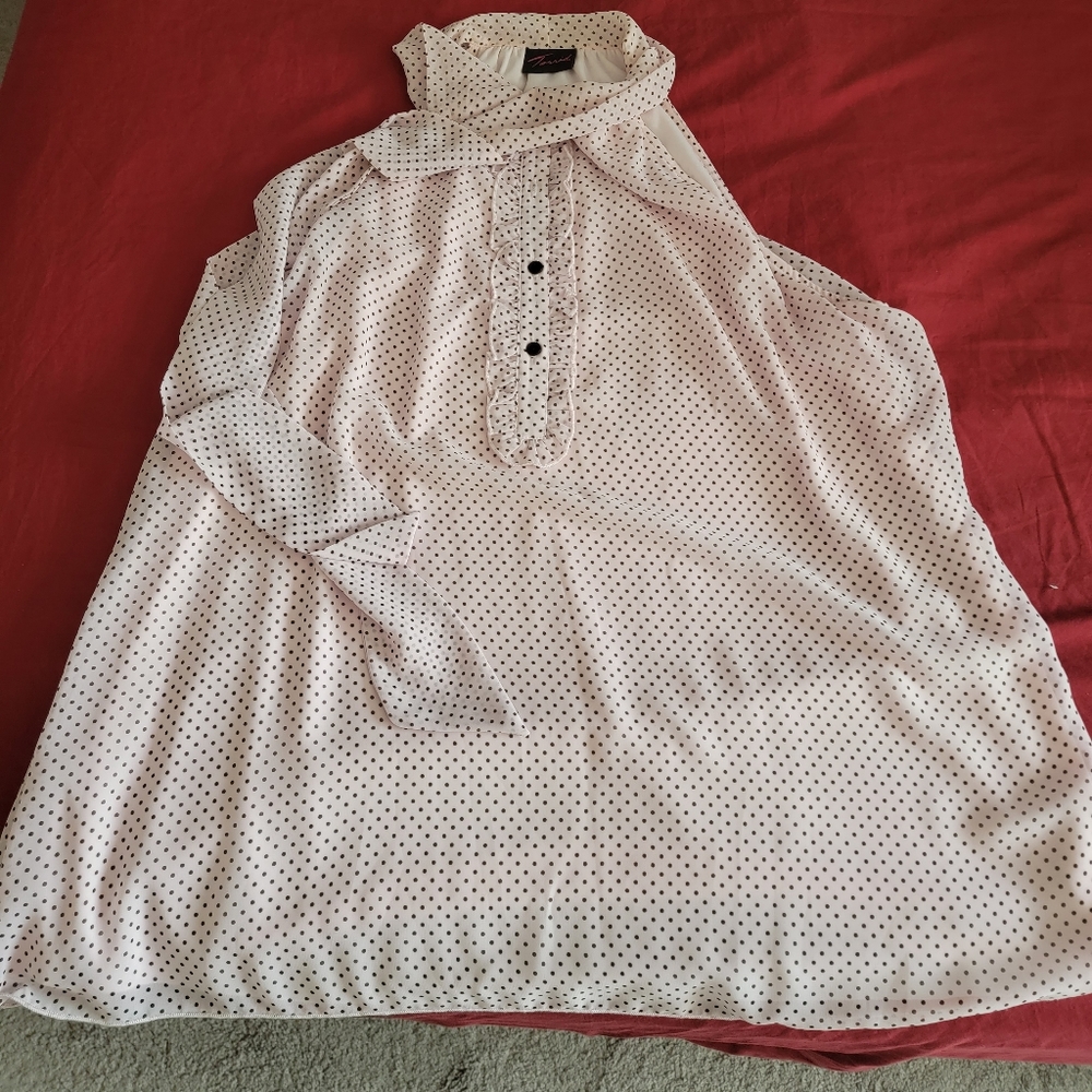 Pink and black polka dot sleeveless blouse